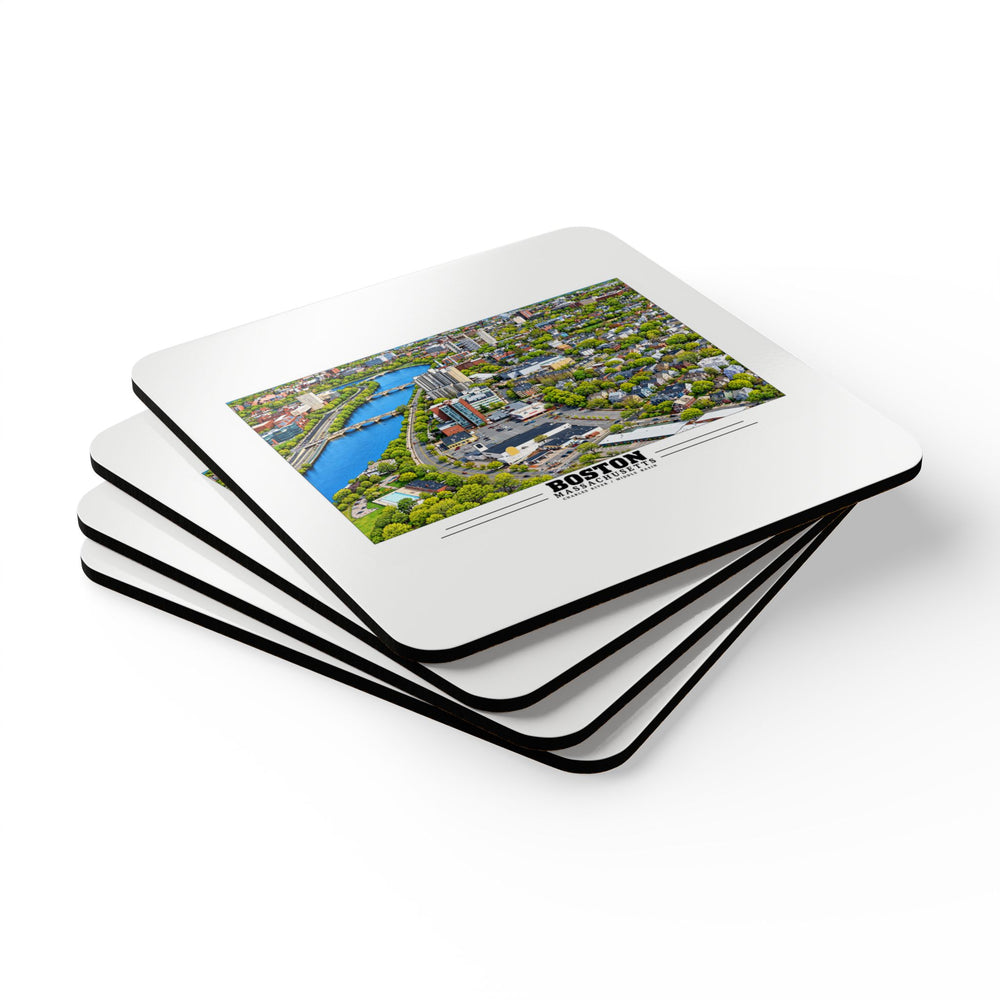 Stack of square coasters with Charles River aerial city view with bridges, buildings and green trees artwork visible on the top coaster