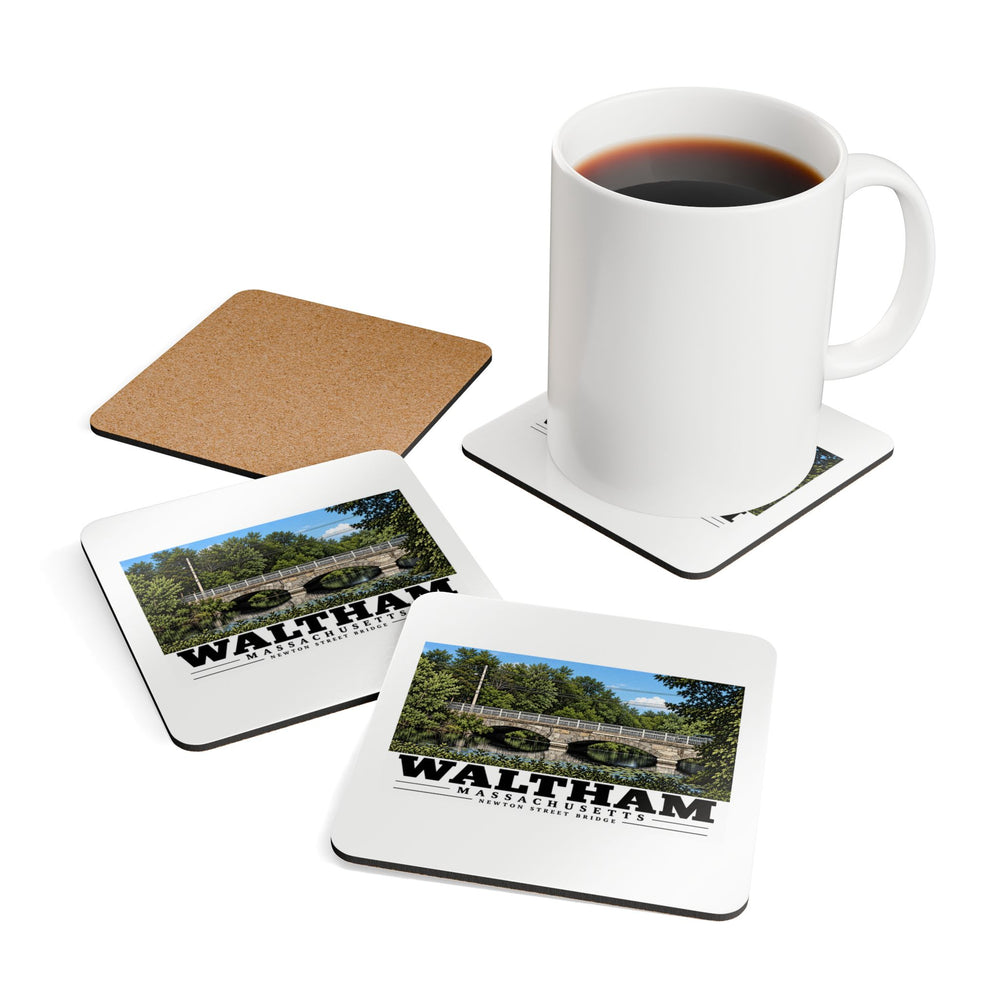 Coffee mug resting on a Newton Street Bridge coaster beside two printed coasters and an exposed cork back.