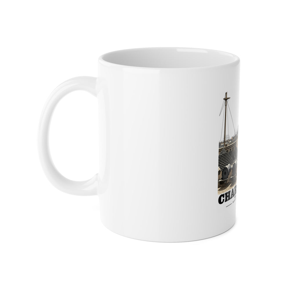 Left side of white ceramic mug showing handle and partial Water Battery artwork