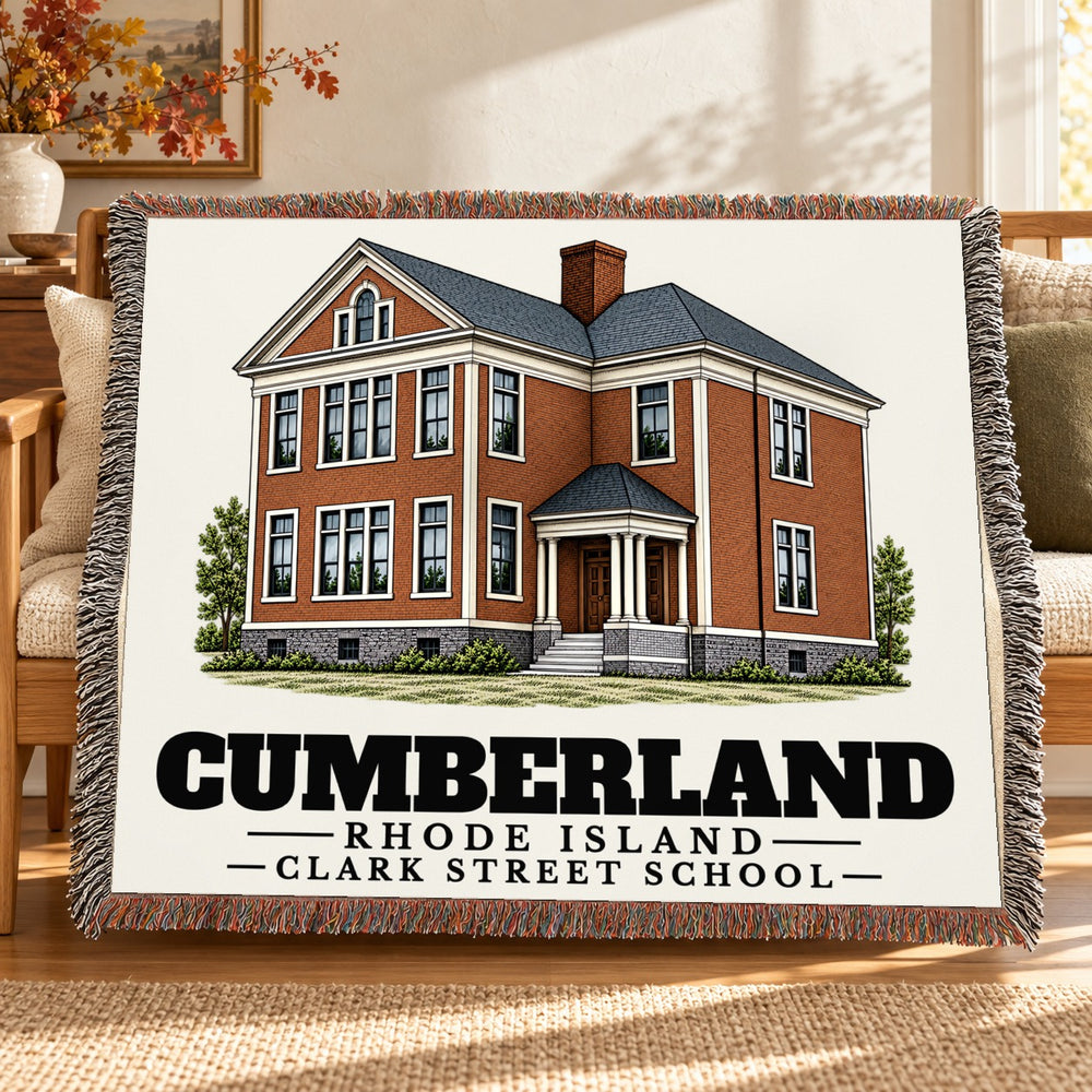 Clark Street School woven blanket draped on a sofa in a living room — Cumberland, Rhode Island