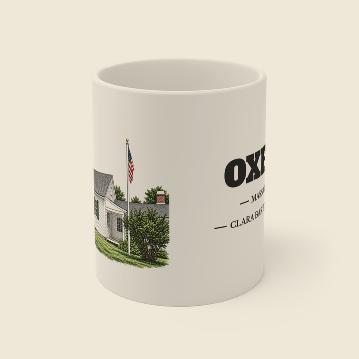 Oxford Clara Barton Birthplace colored engraving on an 11 oz white ceramic mug, cream display background