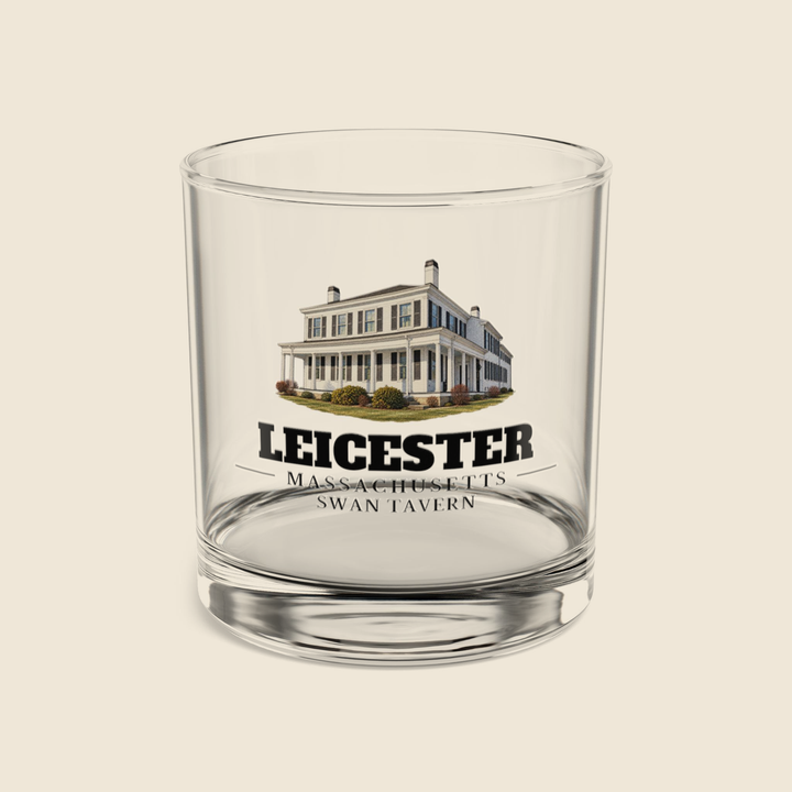 Leicester Swan Tavern rocks glass with colored engraving, shown on a cream background