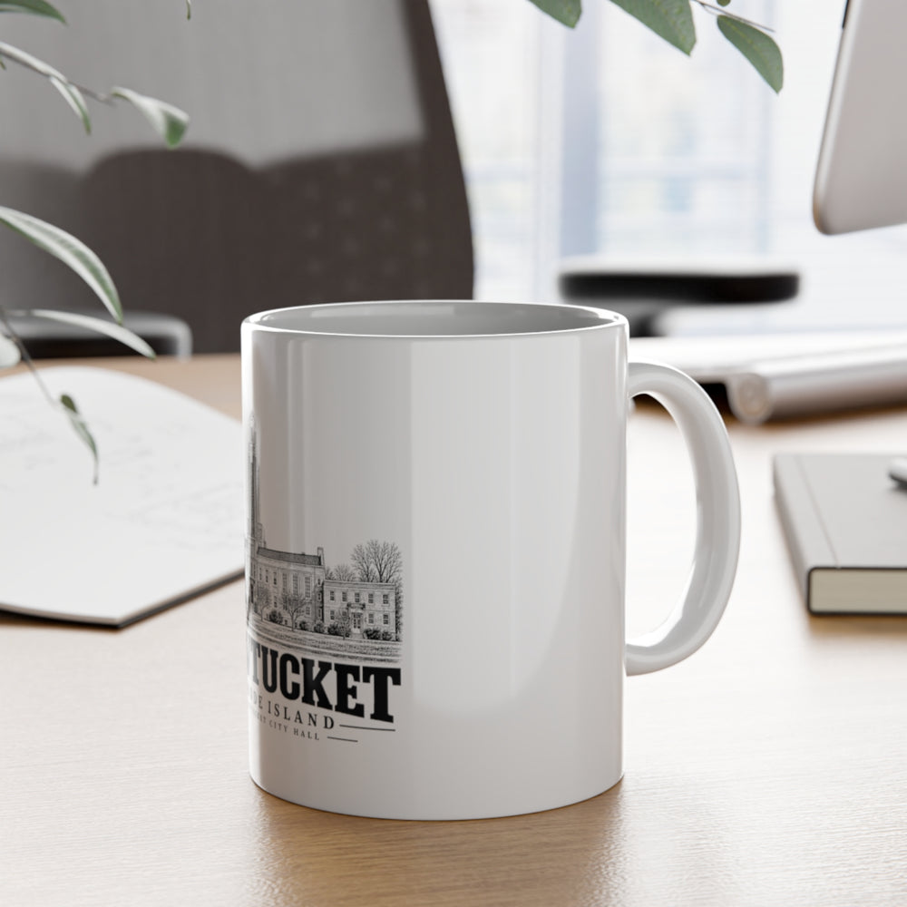 Pawtucket City Hall — White 11-ounce ceramic mug, on desk with handle visible.
