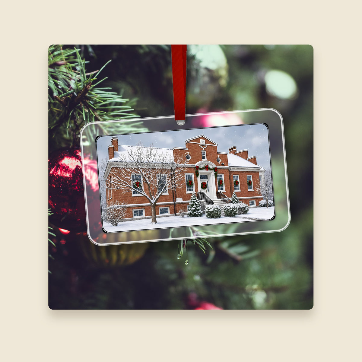 Carnegie Library in Millbury, MA acrylic Christmas ornament hanging on a Christmas tree