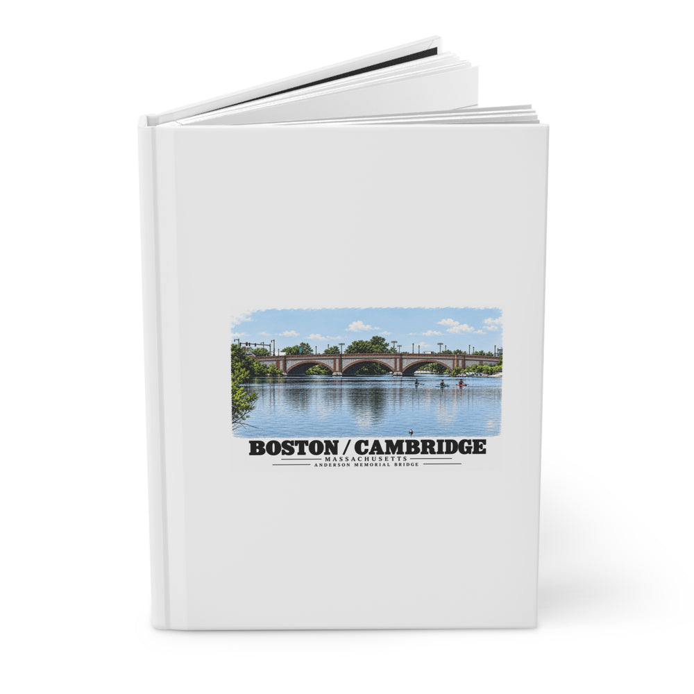 Partly opened white hardcover journal showing Anderson Memorial Bridge and scullers artwork on the front