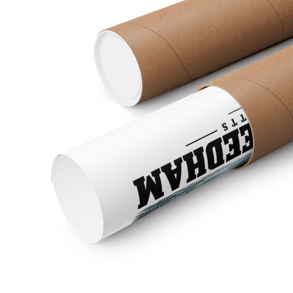 Rolled poster partly emerging from a cardboard tube with partial Newton/Needham lettering and design visible.