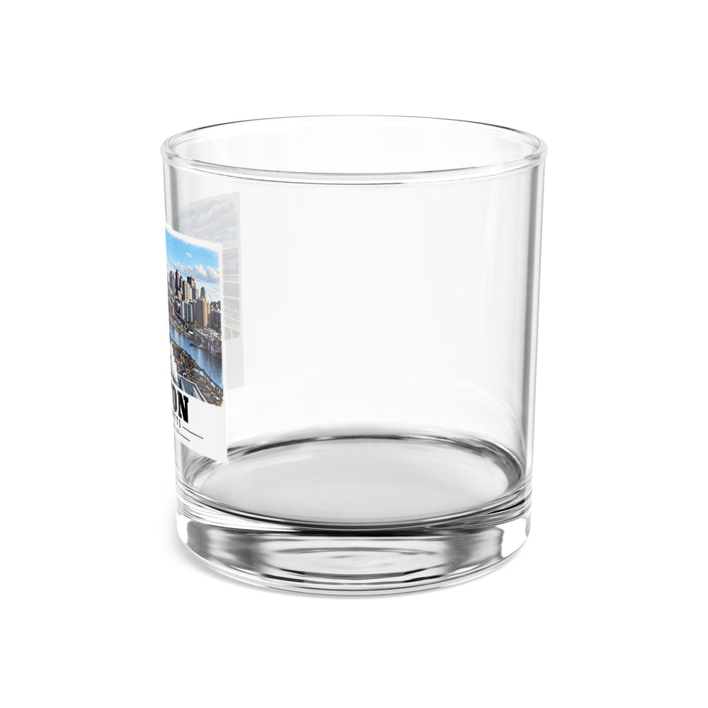 Side view of clear rocks glass with mostly unprinted surface and part of Boston skyline, cable-stayed bridge and Charles River basin print at left