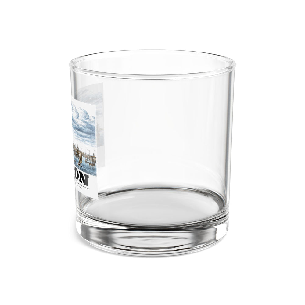Side view of clear rocks glass with mostly unprinted surface and part of Boston Harbor waterfront scene with sailing ships print at left