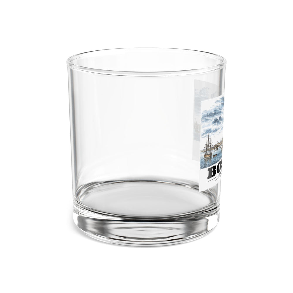 Side view of clear rocks glass with mostly unprinted surface and part of Boston Harbor waterfront scene with sailing ships print at right