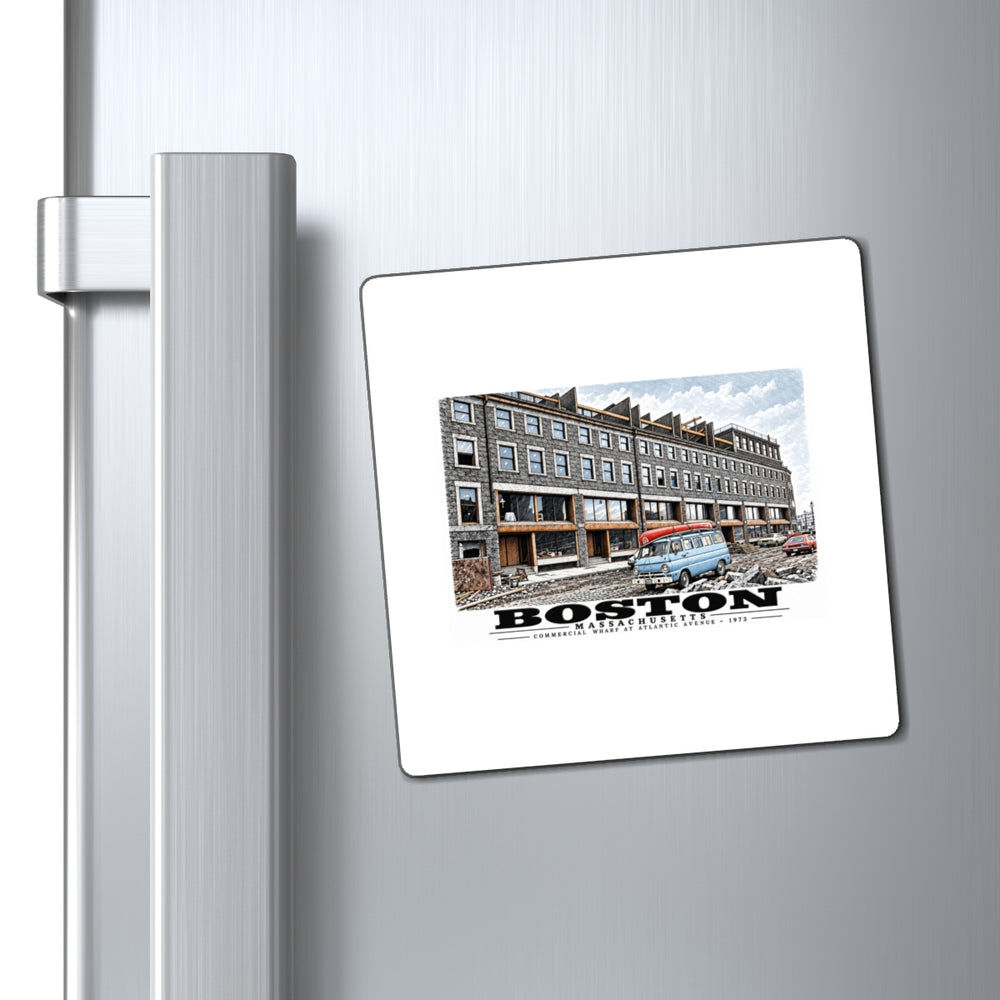 Commercial Wharf Street buildings, blue van and renovation debris magnet on a refrigerator beside its handle