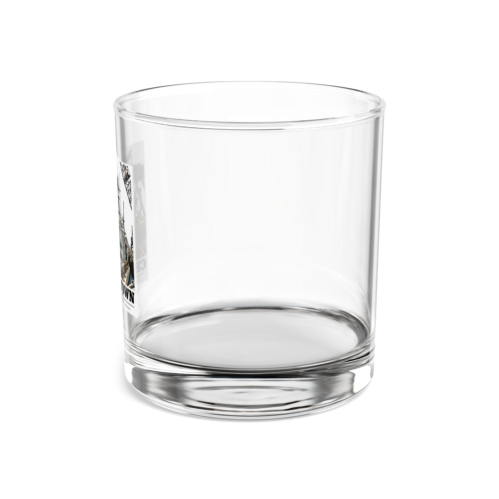 Left side of clear rocks glass showing partial USS Arkansas artwork