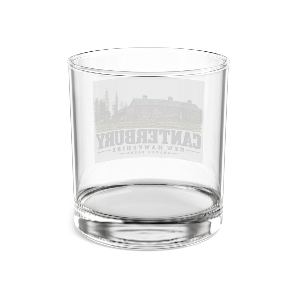Transparent reverse with front artwork visible through glass of Shaker Barns rocks glass, Canterbury, New Hampshire.