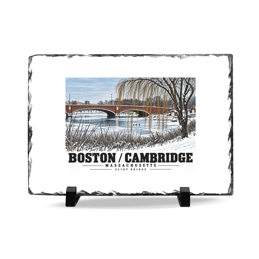 Rough-edged slate display on two black stands with Eliot Bridge winter river view with snow and bare trees artwork and Boston/Cambridge lettering