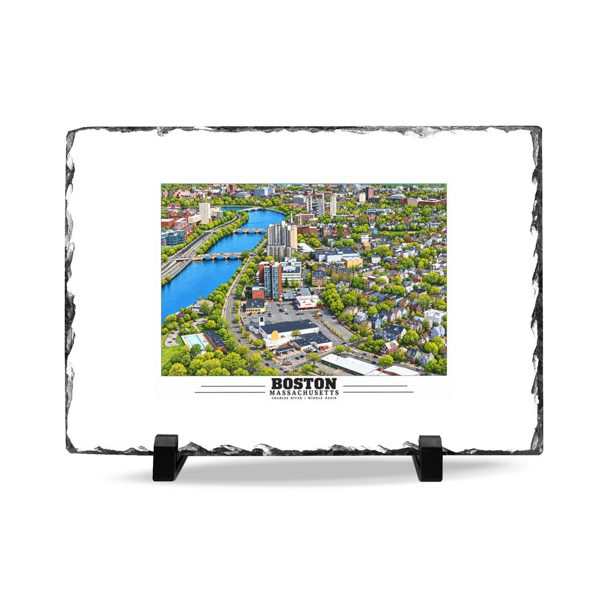 Rough-edged slate display on two black stands with Charles River aerial city view with bridges, buildings and green trees artwork and Boston lettering