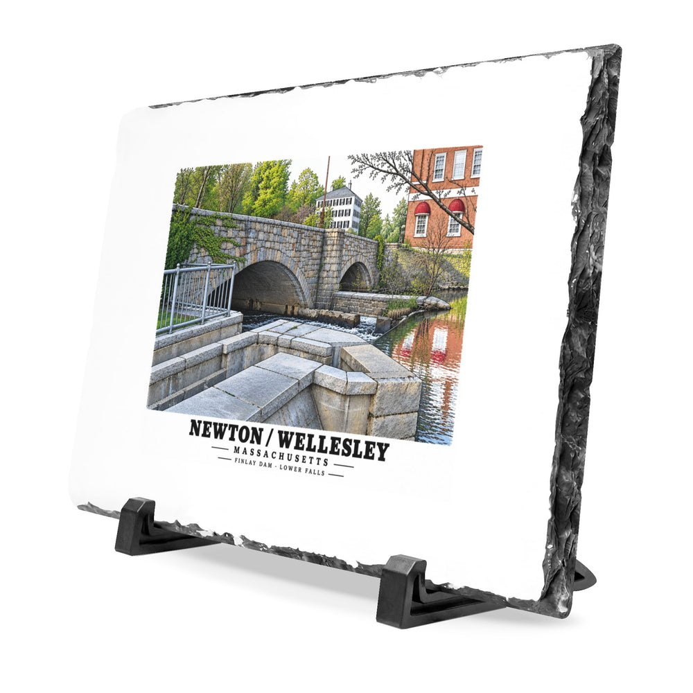 Angled rough-edged slate display on black stands showing Finlay Dam stone arches and water artwork