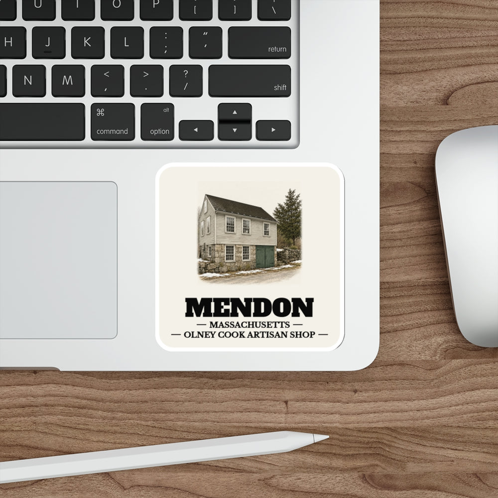 Mendon Olney Cook Artisan Shop sticker shown on a laptop