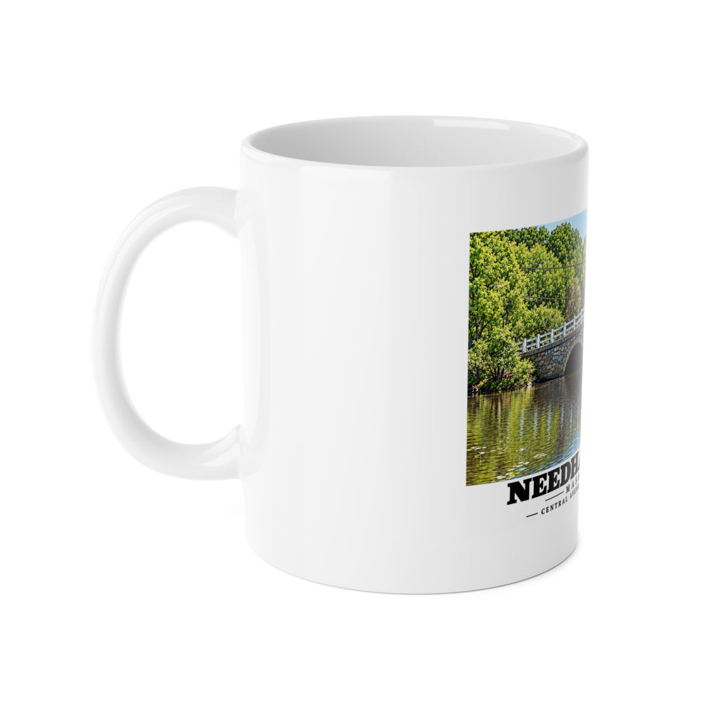 White mug with handle at left and part of the Central Avenue / Centre Street Bridge stone arches and river print at right