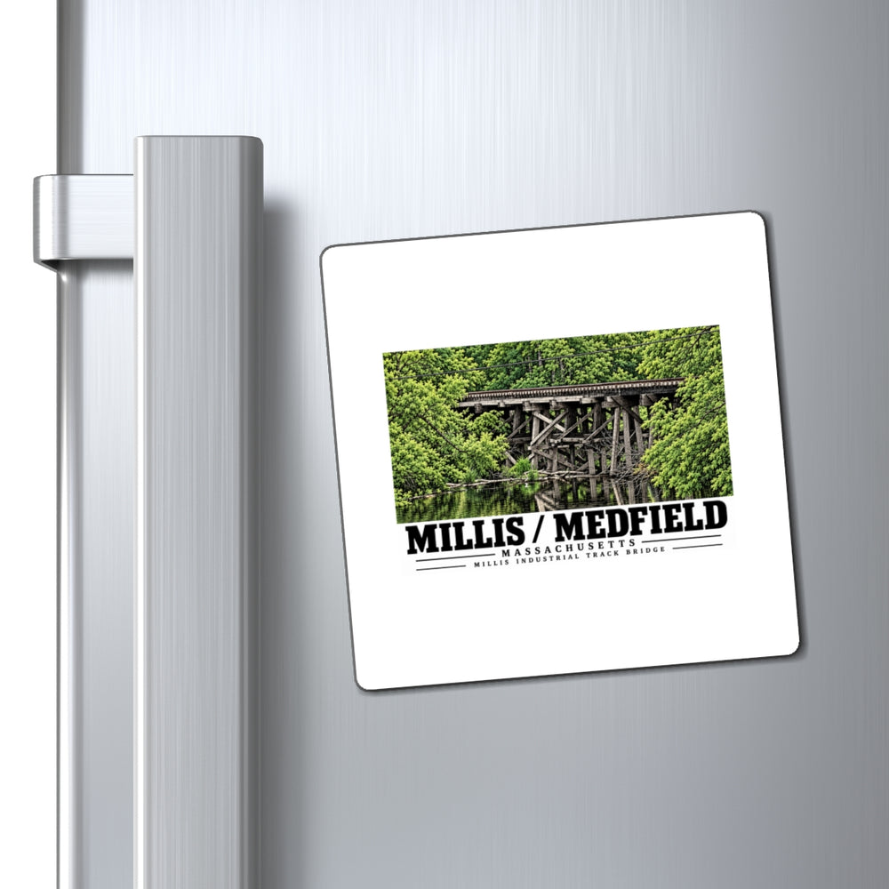Millis Industrial Track wooden railway trestle and green foliage magnet on a refrigerator beside its handle