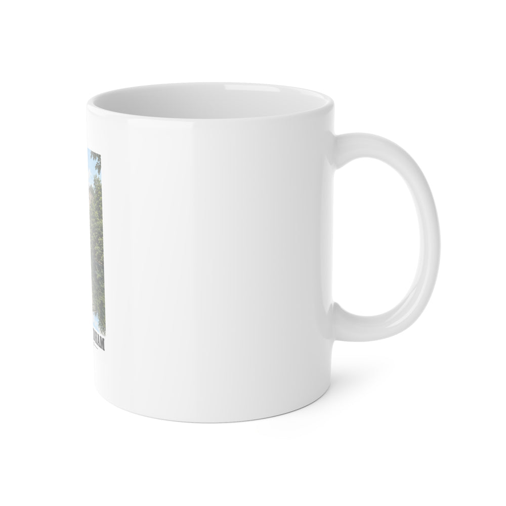 White mug with handle at right and part of the Echo Bridge portrait print at left