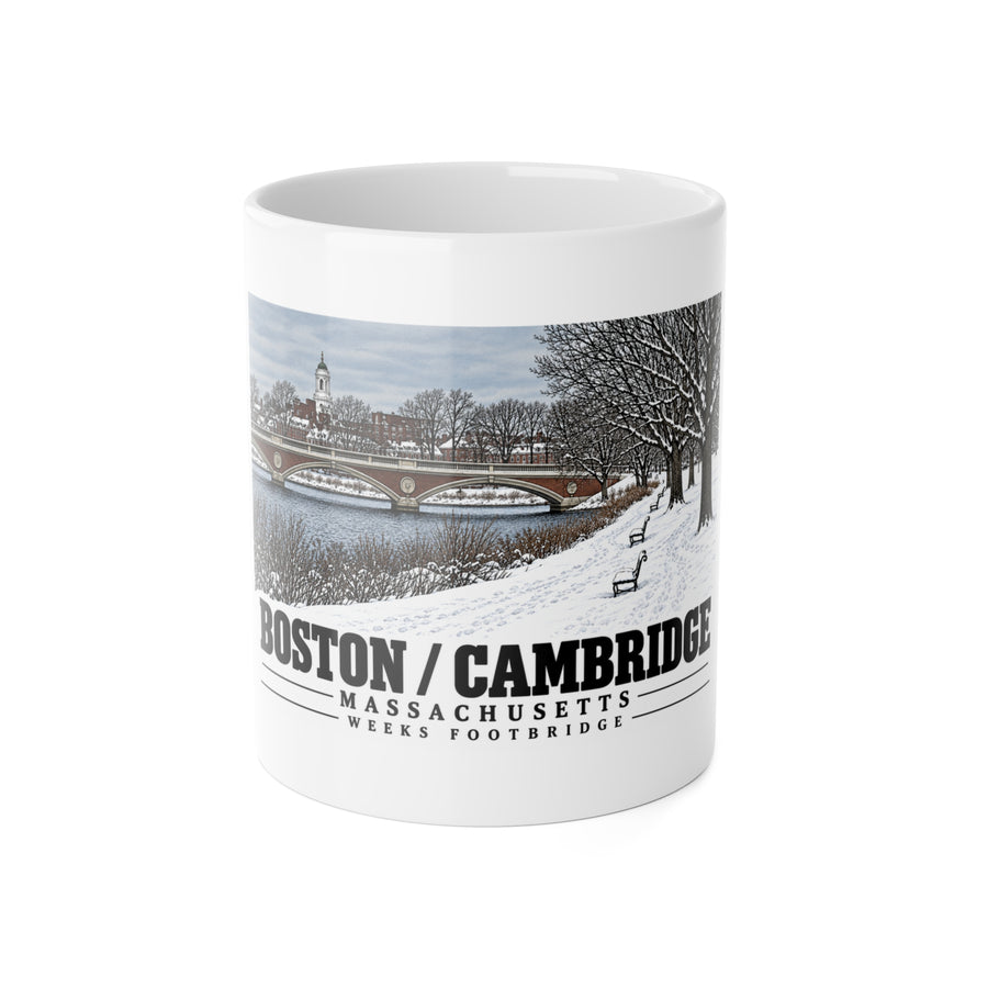 White mug showing Weeks Footbridge winter riverbank view with snow and benches artwork and Boston/Cambridge lettering