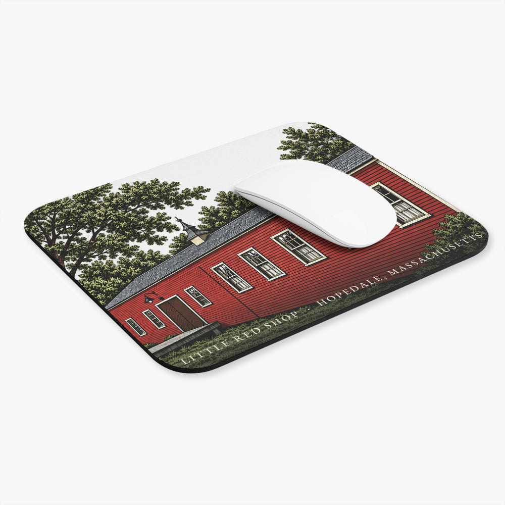 Hopedale Little Red Shop mouse pad shown on a desk with a mouse