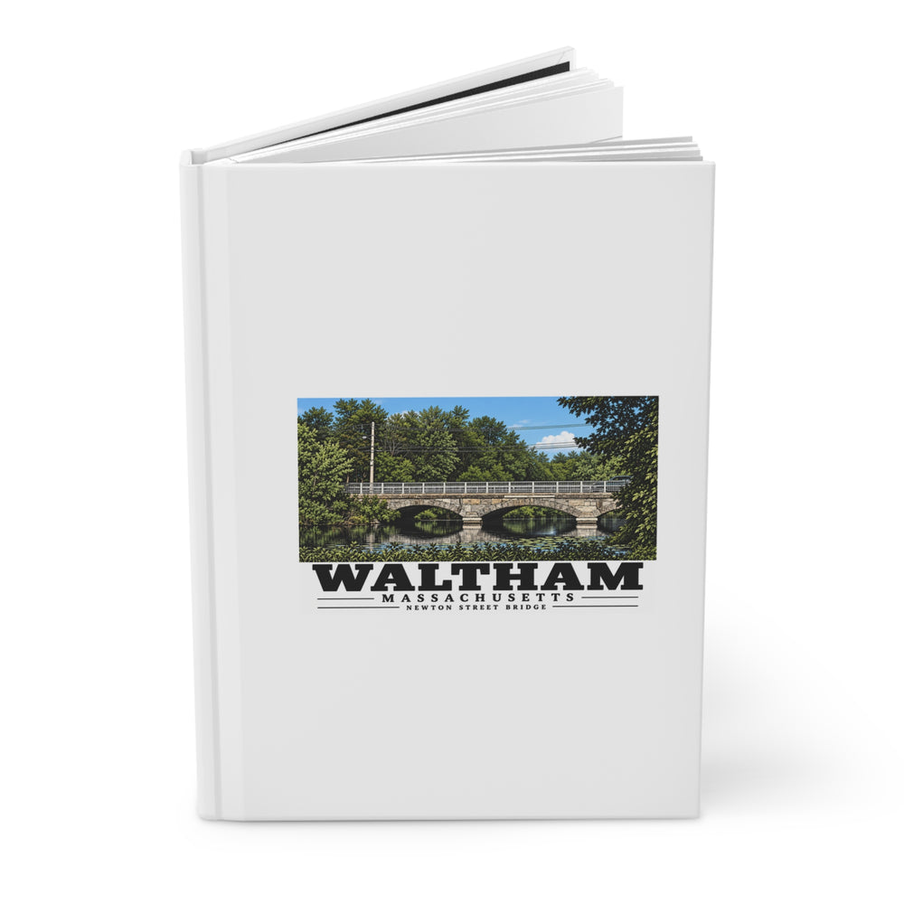 Angled view of the partly open hardcover journal with Waltham Newton Street Bridge artwork on its front cover.