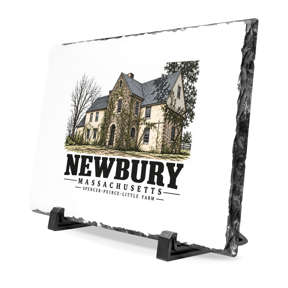 Angled front on display stands of Spencer-Peirce-Little Farm slate desk plaque, with Newbury, Massachusetts artwork and lettering.