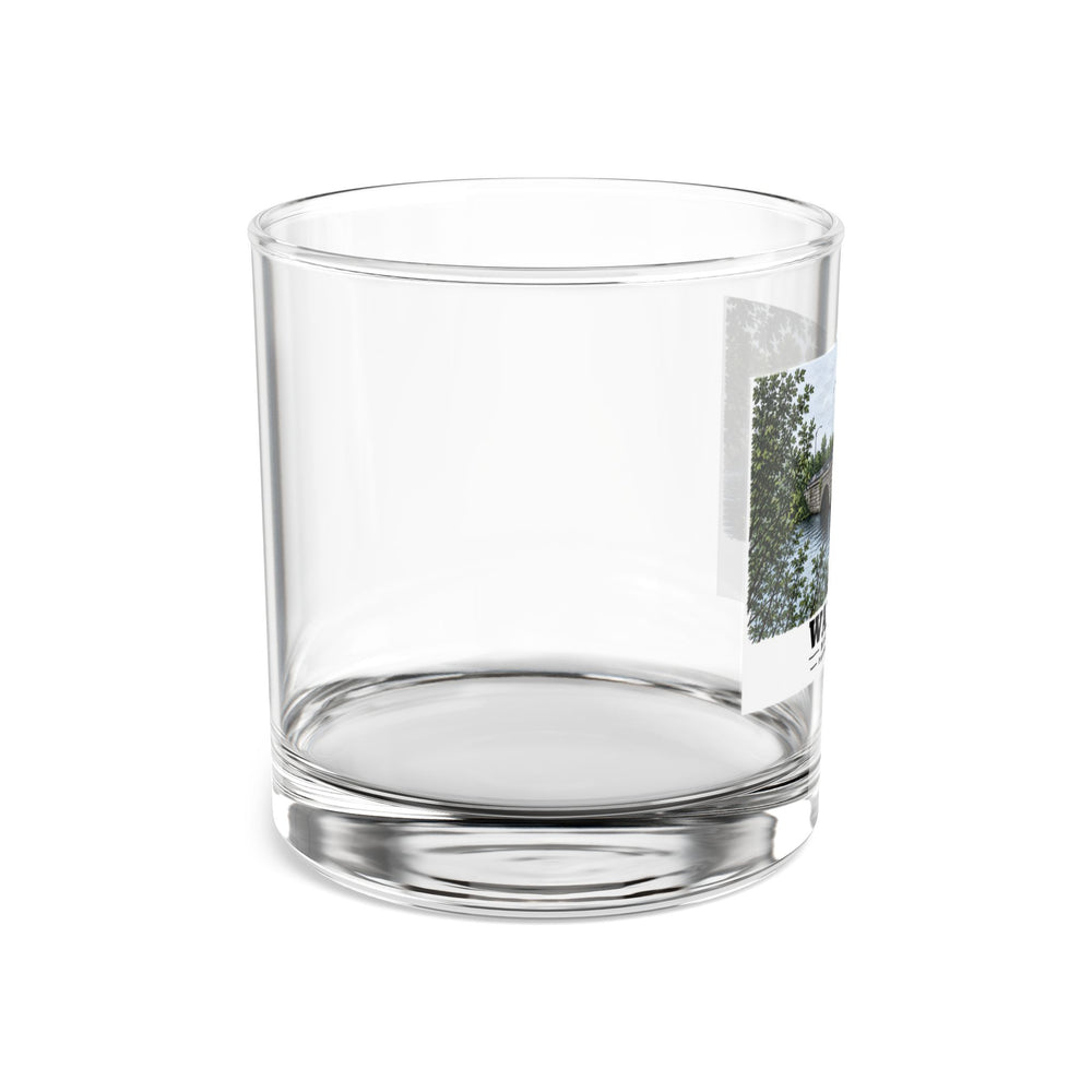 Side view of clear rocks glass with mostly unprinted surface and part of Prospect Street Bridge stone arches and river print at right