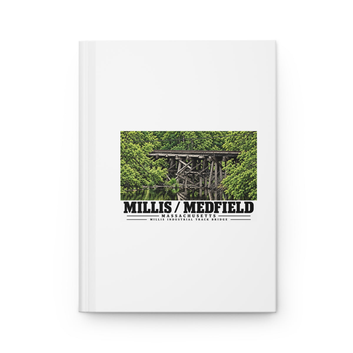 White hardcover journal with Millis Industrial Track wooden railway trestle and green foliage artwork and Millis/Medfield lettering