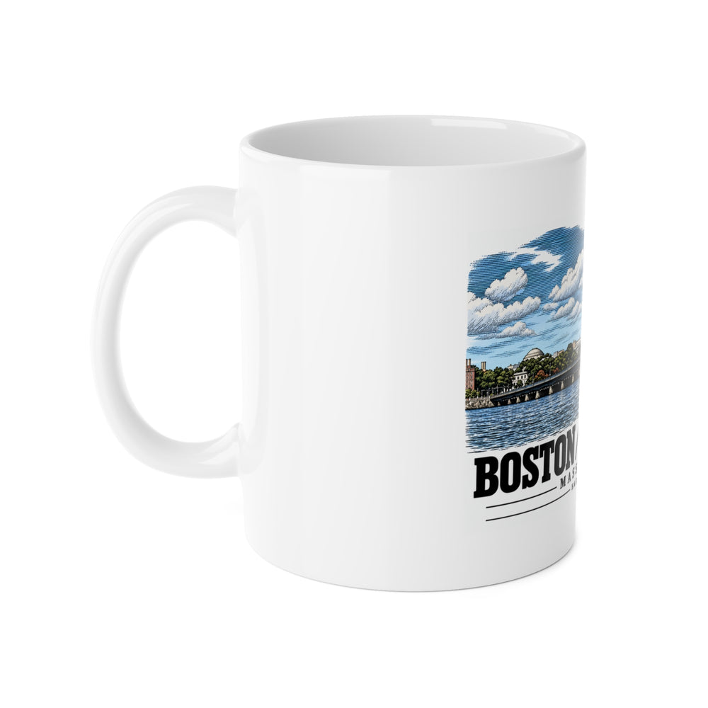 White mug with handle at left and part of the Harvard Bridge river and skyline view print at right