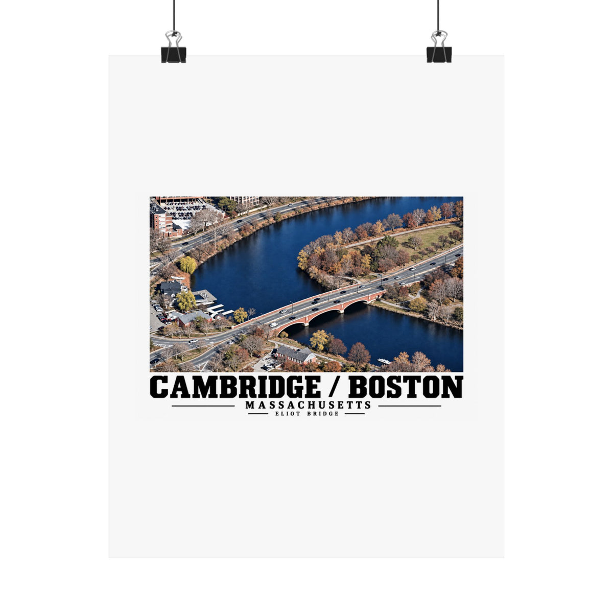 Eliot Bridge aerial river view poster with Cambridge/Boston lettering hanging from two binder clips