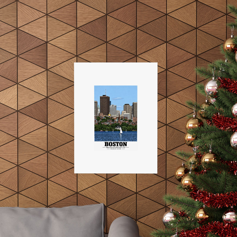 Boston and Charles River poster on a wood-patterned wall beside a decorated evergreen.