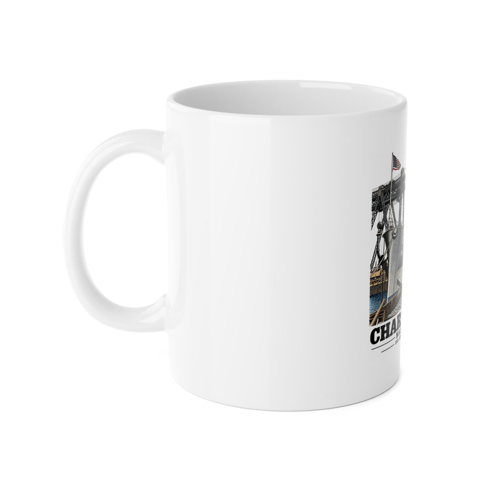 Left side of ceramic mug showing handle and partial USS Arkansas artwork at Boston Navy Yard