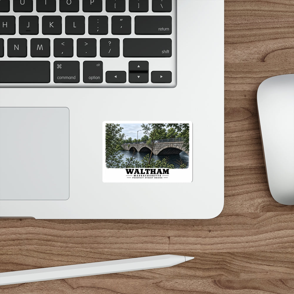 Sticker showing Prospect Street Bridge stone arches and river artwork on a laptop beside its keyboard