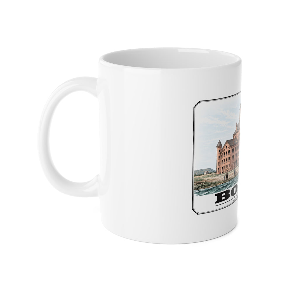 White mug with handle at left and part of the large symmetrical alms house building, grounds and figures print at right