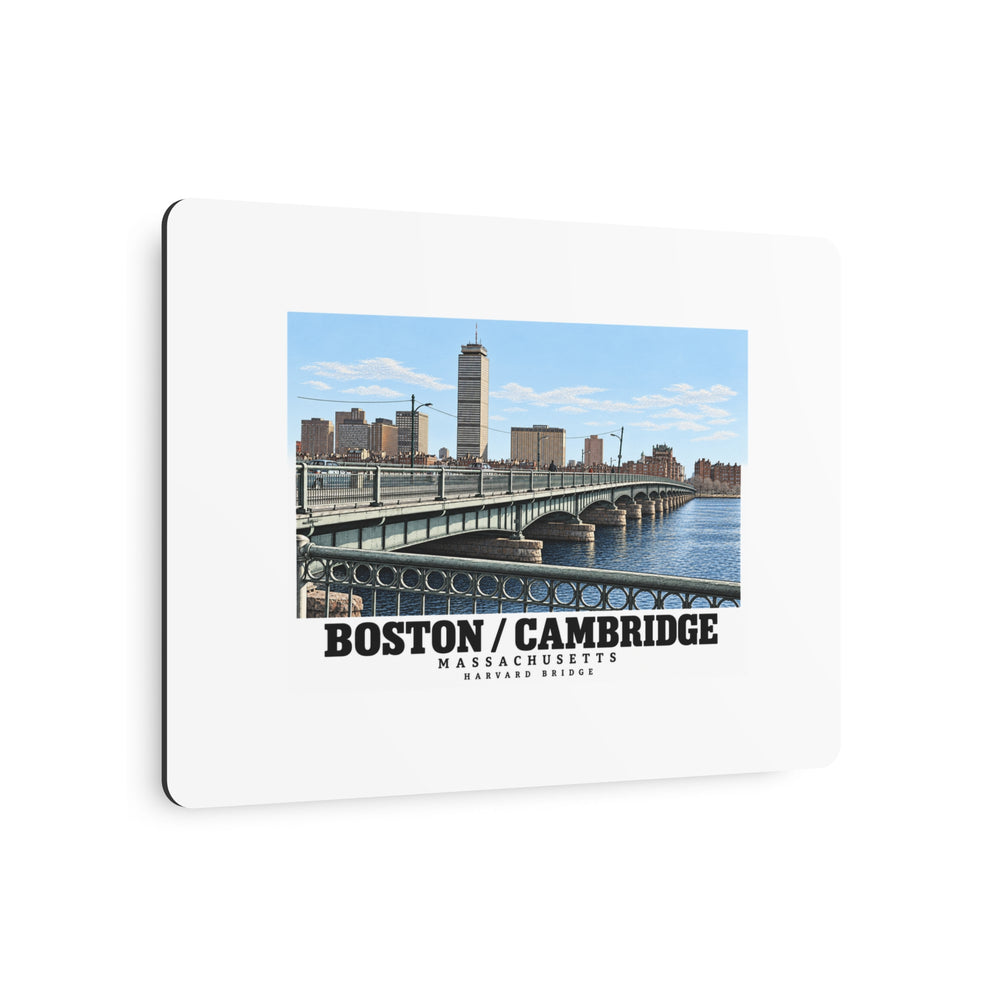 Angled metal sign showing Harvard Bridge artwork and Boston/Cambridge lettering and the edge