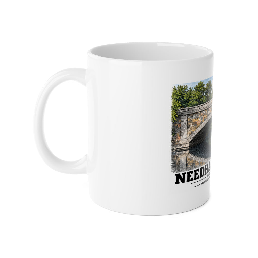White mug with handle at left and part of the Greendale Avenue / Lyons Street Bridge stone arch and reflection print at right