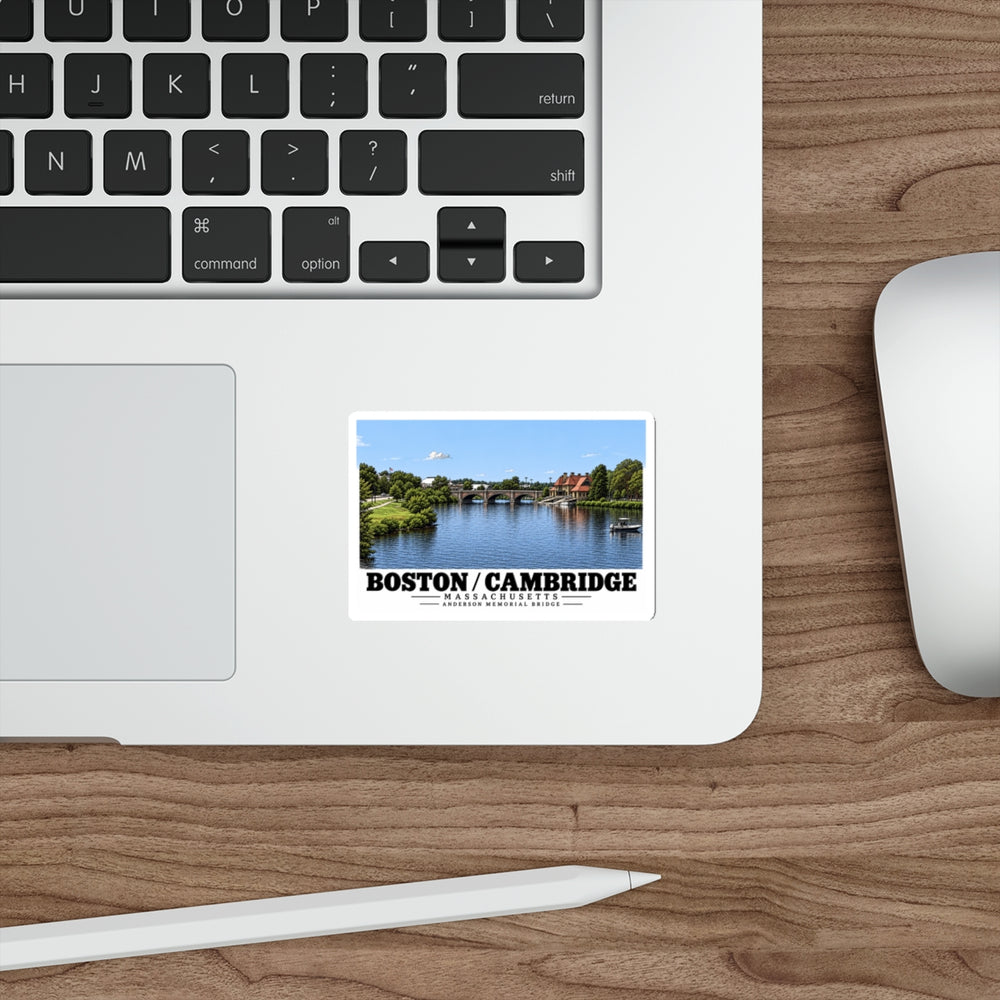 Sticker showing Anderson Memorial Bridge distant river view artwork on a laptop beside its keyboard