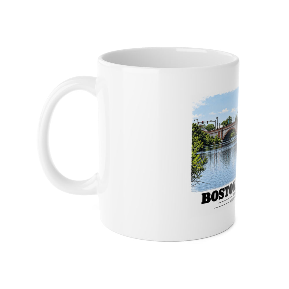 White mug with handle at left and part of the Anderson Memorial Bridge and scullers print at right