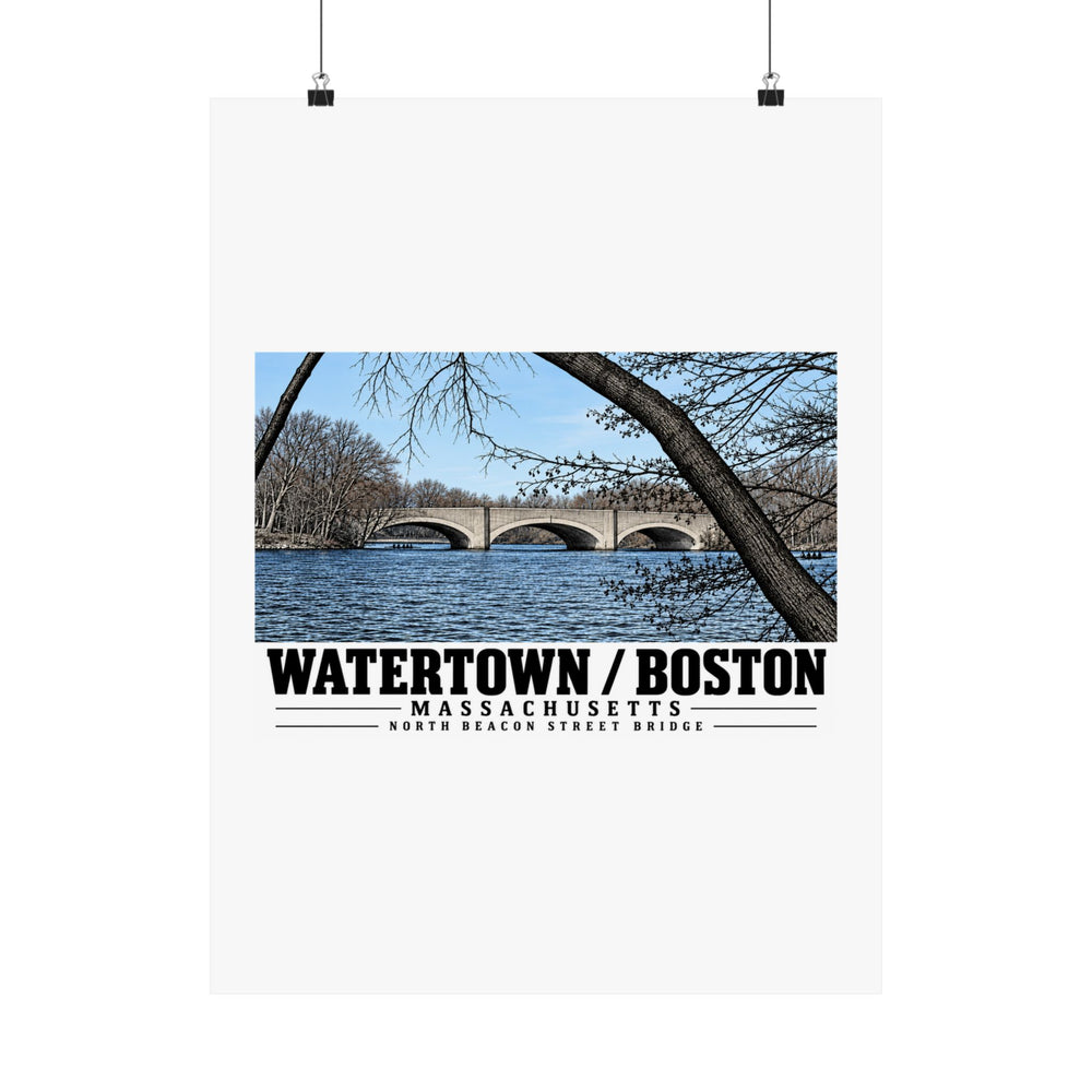 North Beacon Street Bridge stone arches framed by a bare tree poster with Watertown/Boston lettering hanging from two binder clips