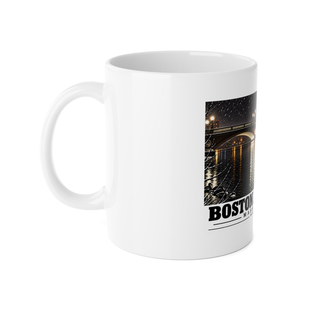 White mug with handle at left and part of the Weeks Footbridge illuminated night view with water reflections print at right