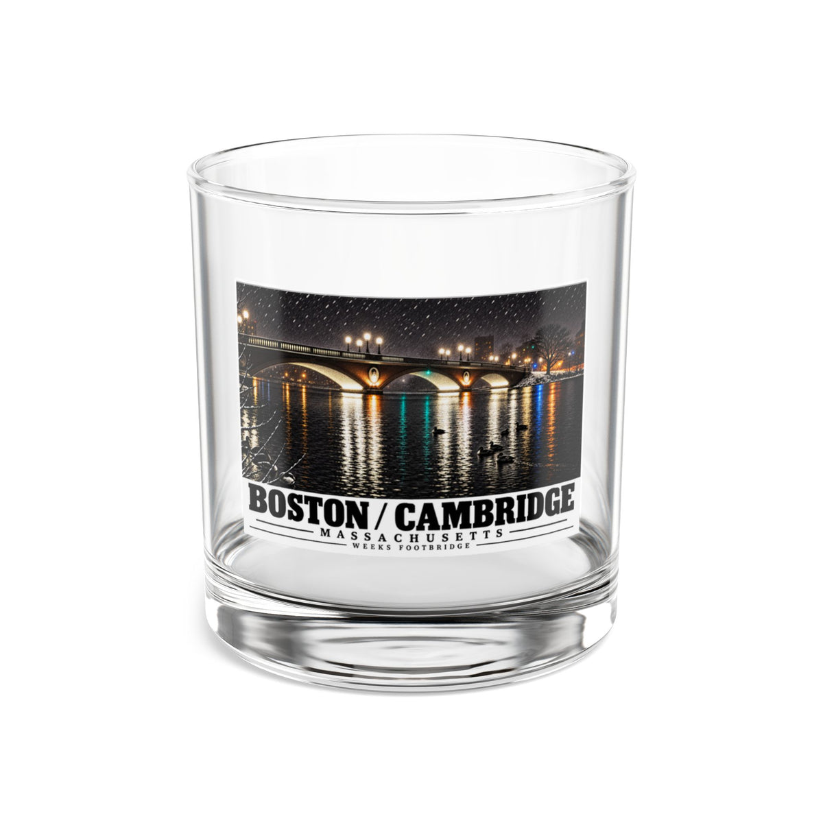 Clear rocks glass showing Weeks Footbridge illuminated night view with water reflections artwork and Boston/Cambridge lettering