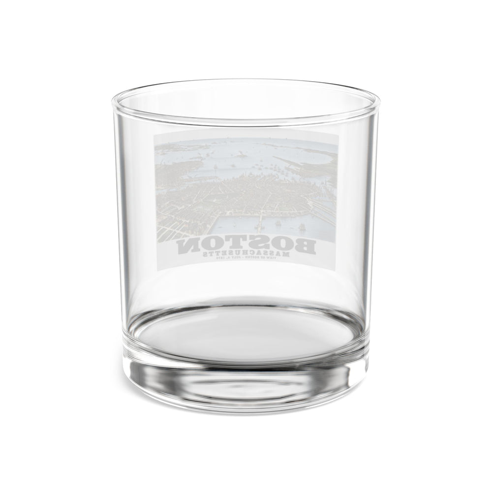 Rear view of clear rocks glass with historic Boston harbor panorama with boats and waterfront buildings print and reversed lettering visible through the glass