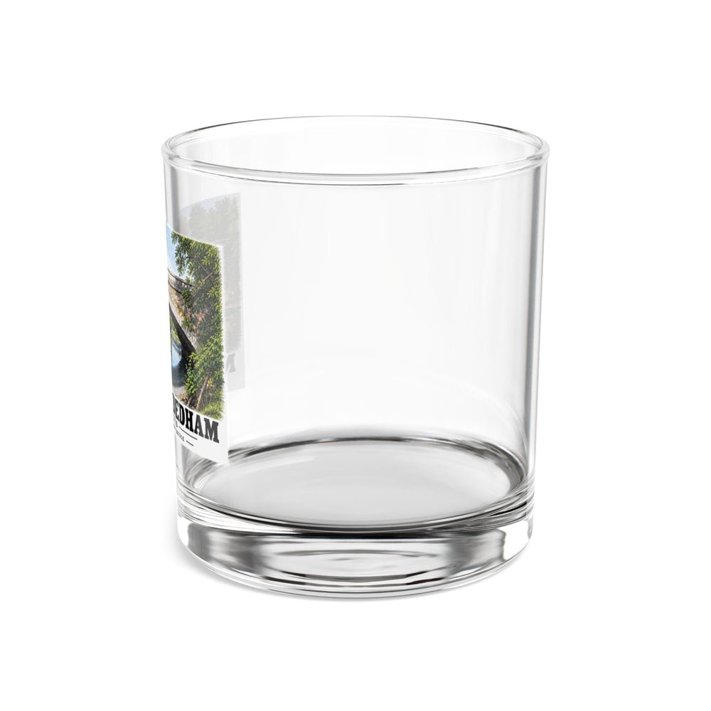 Side view of clear rocks glass with mostly unprinted surface and part of Greendale Avenue / Lyons Street Bridge stone arch and reflection print at left