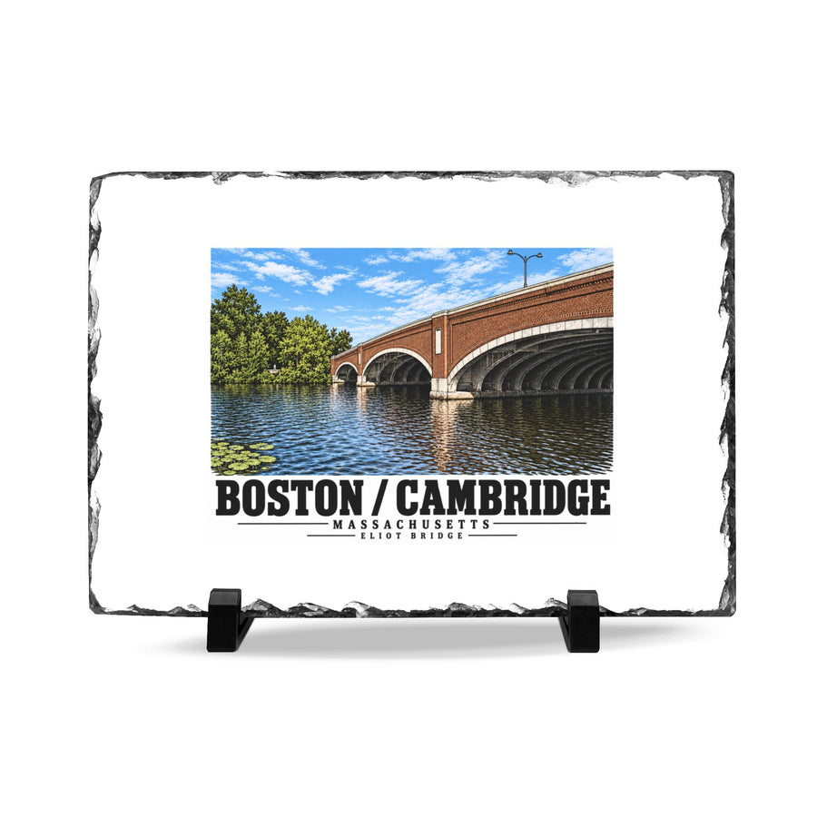 Rough-edged slate display on two black stands with Eliot Bridge close red brick arch view artwork and Boston/Cambridge lettering