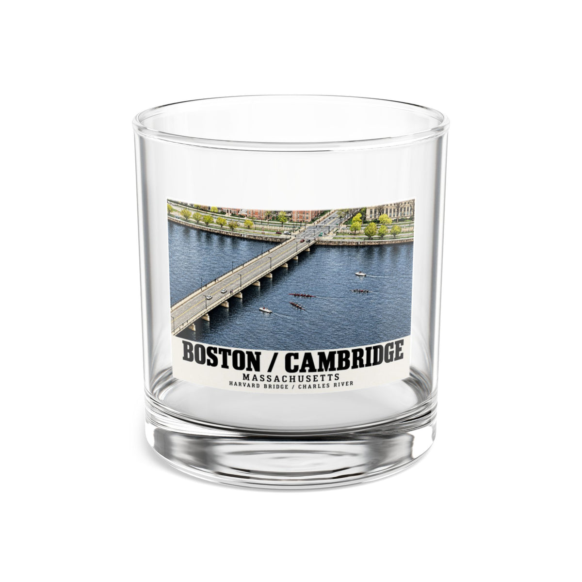 Clear rocks glass showing Harvard Bridge aerial view with scullers on the Charles River artwork and Boston/Cambridge lettering
