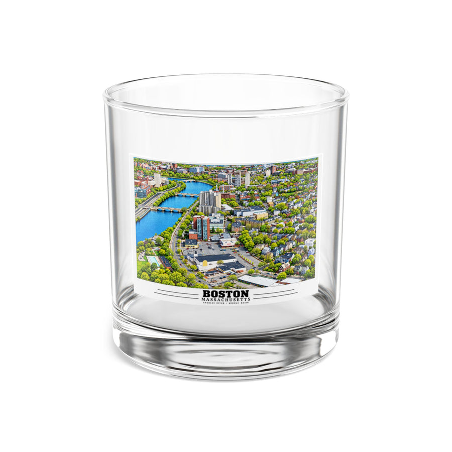 Clear rocks glass showing Charles River aerial city view with bridges, buildings and green trees artwork and Boston lettering