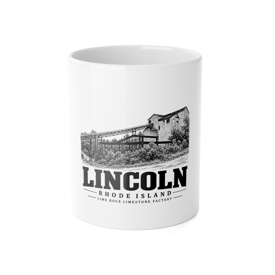 Front view of a white ceramic mug with black-and-white Lincoln, Rhode Island artwork of Lime Rock limestone factory and conveyor