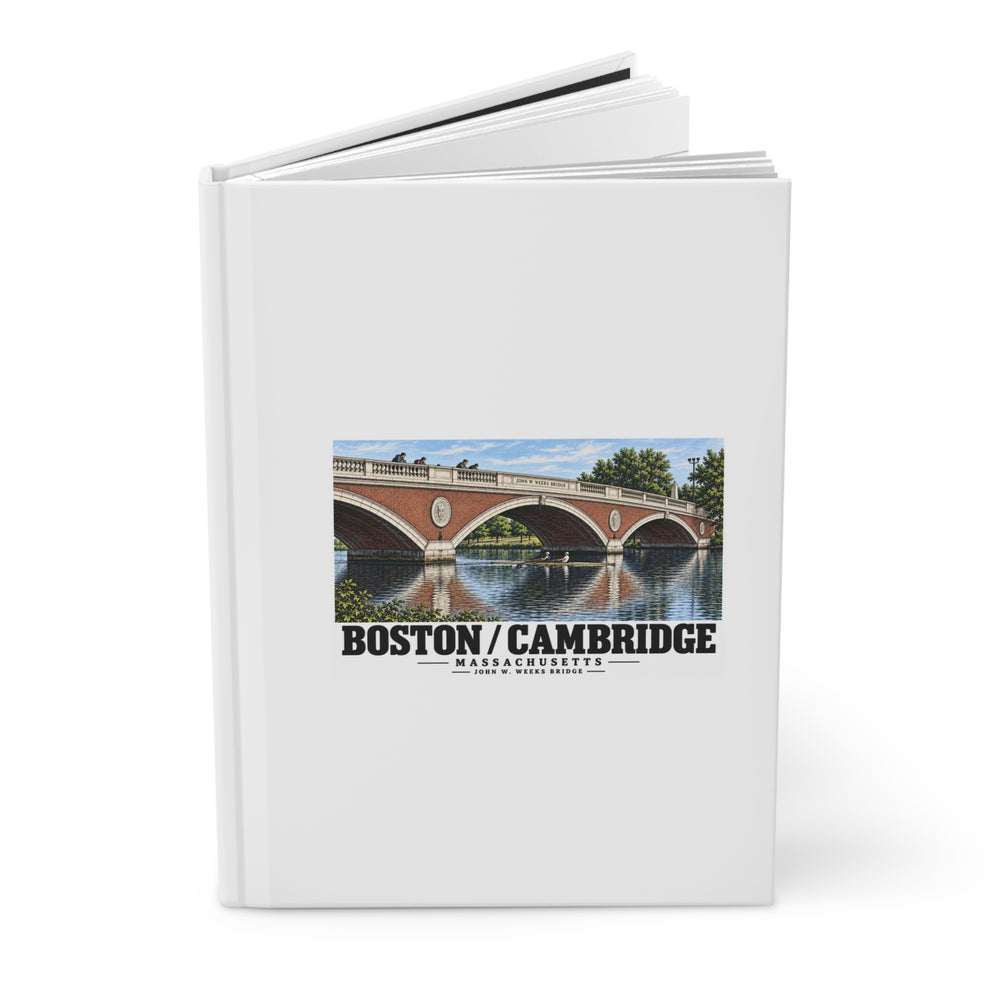 Partly opened white hardcover journal showing John W. Weeks Bridge and scullers artwork on the front