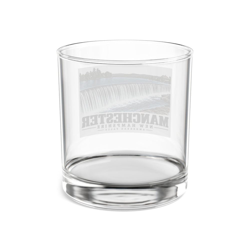 Transparent reverse of Amoskeag Falls rocks glass, with Manchester, New Hampshire artwork and lettering.